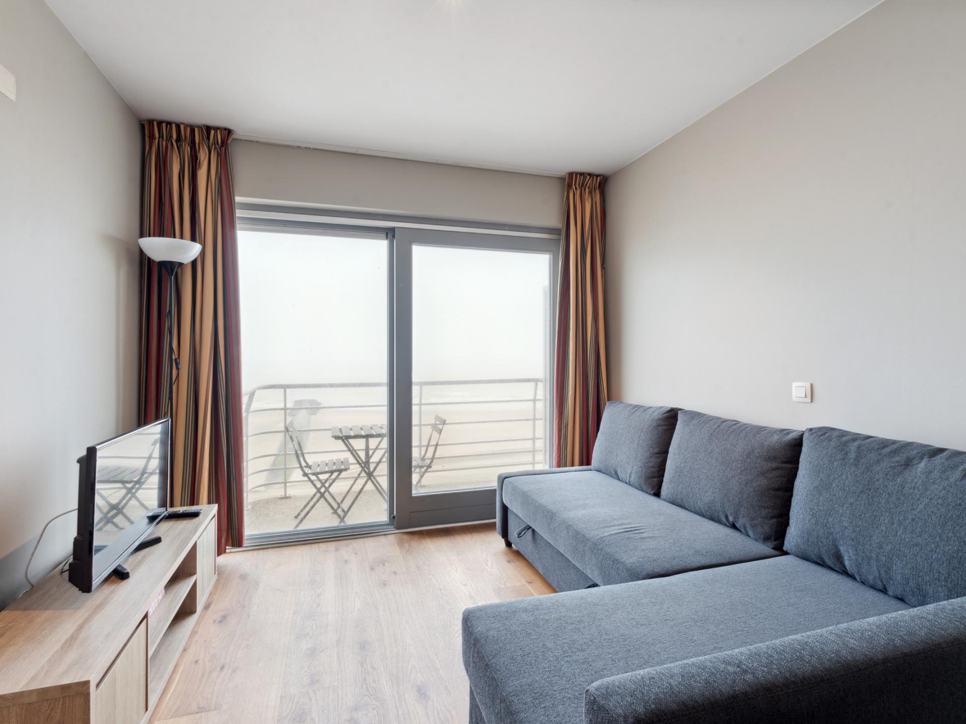 Knusse studio met uitzicht op zee en strand